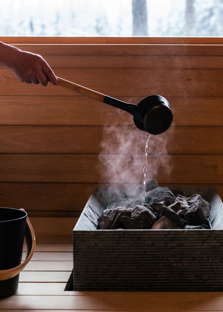 Steam rising in a wood-panelled sauna